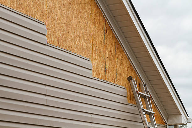 Professional Siding Replacement technician working in Selden, NY